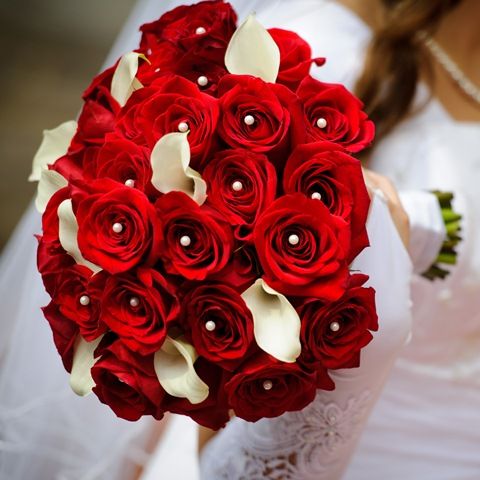 Bridal bouquet of red roses with diamond pins